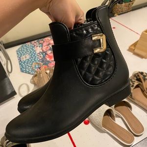 Black Chelsea boots with belt buckle